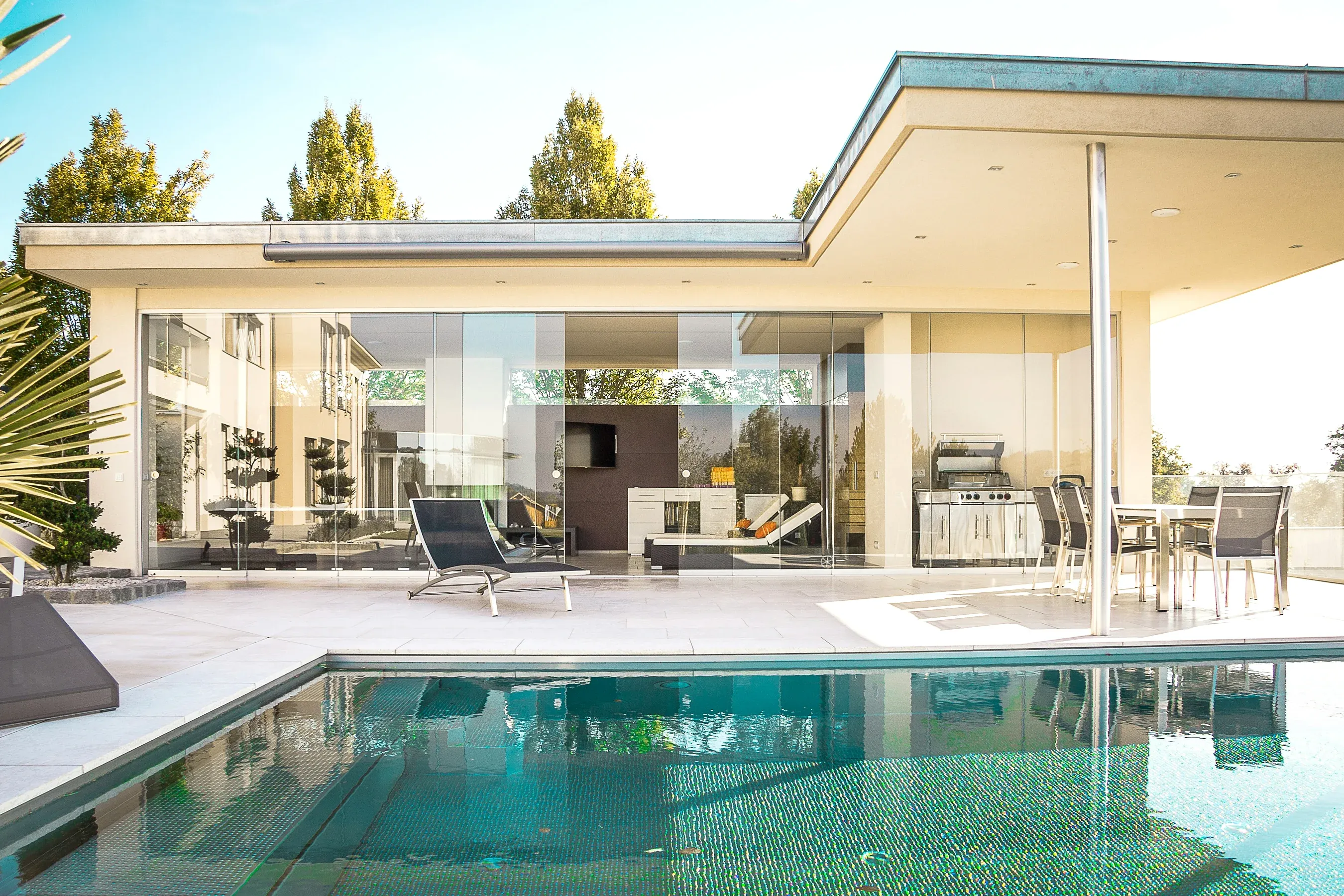Modern villa with a pool and a glass-walled terrace
